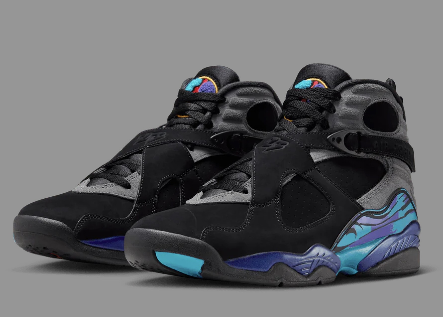 Air Jordan 8 “Aqua” shoe in black with aqua and purple accents, shown from a side angle